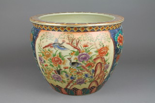 A late 20th Century Chinese fish bowl with panels of exotic birds and flowers 18" 