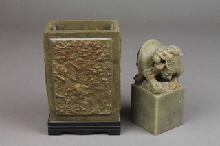 A carved soapstone desk seal with shi shi finial 4 1/2", a ditto rectangular carved pot decorated with bats amongst clouds 5 1/2"