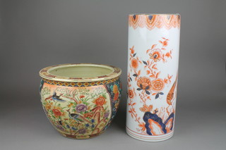 A late 20th Century Chinese fish bowl with panels of flowers and birds 14", a ditto Imari style stick stand 22"