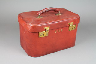 A lady's red leather D shaped vanity case with gilt metal mounts 8"h x 13"w x 8 1/2"d 