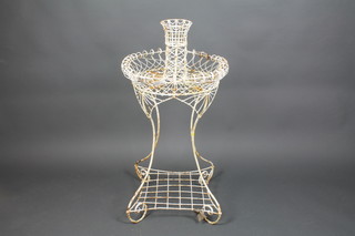 A Victorian circular wire work planter with square undertier, raised on shaped supports 41"h x 22" diam. 