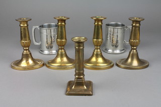 2 pairs of Adam style brass candlesticks 6 1/2", 1 other candlestick 6", a pair of pewter tankards and a glass bottle