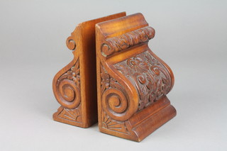 A pair of Victorian carved walnut bookends in the form of Vitruvian scrolls 7"