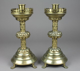A pair of 19th Century brass Gothic style candlesticks 13" 