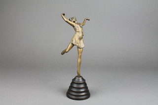 An Art Deco style bronze figure of a dancing girl raised on a cylindrical tapered base 13"