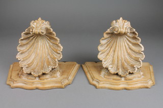 A pair of carved lime wood wall brackets supported by carved scallop shells 10" 