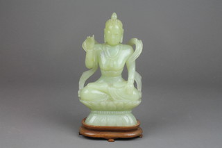 A green hardstone figure of a seated Eastern Deity 8" x 4" 