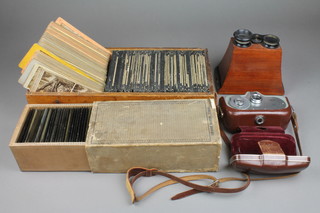 A stereoscopic viewer (f) and a collection of stereoscopic slides and glass slides together with a Movinette 8 cine camera