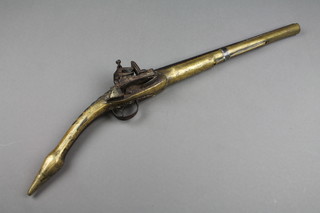 A 19th Century Eastern brass and iron flintlock pistol with 13 1/2" barrel (no ram rod) 