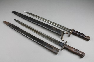 A 1907 Wilkinson Sword bayonet complete with scabbard together with an American  Remington 1917 bayonet complete with scabbard 