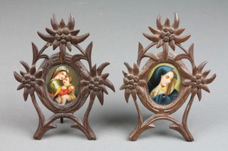 2 Continental porcelain plaques depicting the Virgin Mary, 2" oval, contained in carved wood easel frames