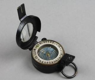 A Military Issue prismatic compass marked T.G.C Co. Ltd London no.312254 Mk 3 1945