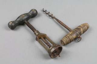 A 19th Century steel corkscrew and 1 other