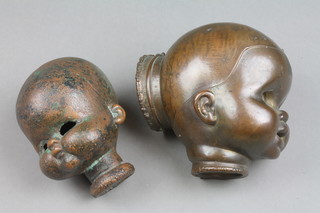 A 19th Century bronze dolls head mould 4" and 1 other 3 1/2"