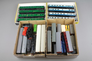 8 Trix coach builders carriages, boxed together with 2 shallow boxes containing a collection of various rolling stock