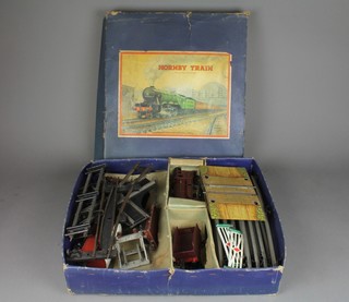 A Hornby O gauge no.601 goods set complete with locomotive tender, level crossing, points and 4 items of rolling stock, boxed 