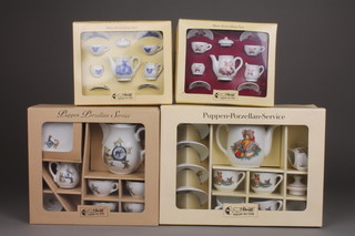 2 Steiff 9 piece dolls house tea services - Teddy Bear Rose and Teddy Bear Blue, comprising coffee pot, cream jug, sugar bowl, 2 cups and 2 saucers together with two 11 piece Steiff childs tea services comprising teapot, milk jug, sugar bowl, 6 cups and 6 saucers 