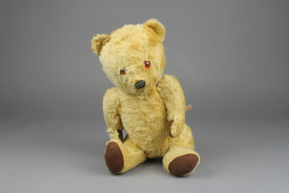 A yellow teddybear with articulated limbs 15" (squeaker f)