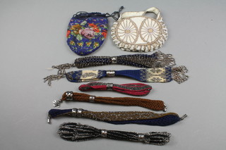 A white oval bead work bag, a blue oval bead work drawstring bag and 6 purses