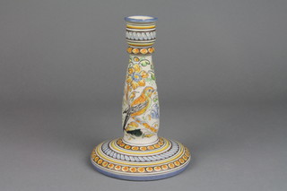 A Continental polychrome candlestick decorated with a bird amongst flowers 8" (f)