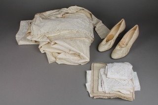 An ivory wedding dress, a pair of ditto shoes and a small collection of fabric