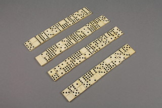 A 54 piece bone dominoe set