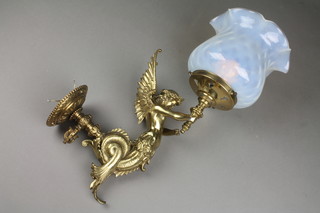 A handsome pair of 19th Century gas light brackets in the form of winged mythical female figures, converted for use as electric lamps 11" and with "vaseline" glass shades