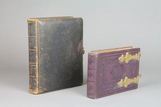 A Victorian red leather bound and gilt mounted photograph album together with a black leather photograph album