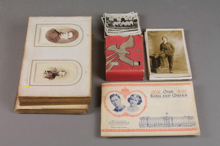 A Victorian photograph album contained in a mother of pearl album and various postcards