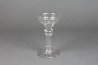 An early 18th Century clear glass sweetmeat with spread neck, tapered stem and foldover foot 6" 