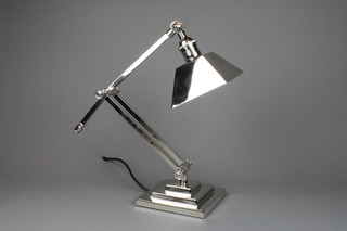 An Art Deco style silver plated adjustable table lamp on a stepped square base
