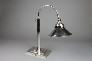 An Art Deco style plated adjustable desk lamp on stepped rectangular base 