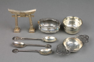 A silver tea strainer and stand Sheffield 1959, a silver salt, 3 spoons and a Chinese silver pepperette in the form of a gate