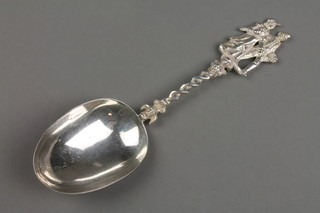 A Dutch silver wedding spoon with pierced stem and import marks