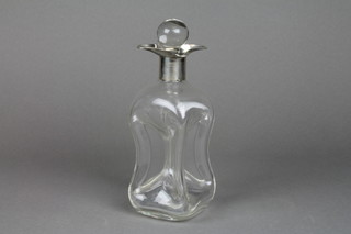 An Edwardian glass spirit decanter with waisted body and silver spout, Birmingham 1906