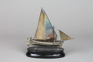 A Continental silver figure of a boat on wood socle, 5" 