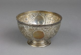 A Victorian silver repousse bowl decorated with scrolls and flowers with vacant cartouches, London 1892, approx 188 grams 