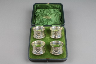 A set of 4 cased silver napkin rings with repousse decoration, Birmingham 1908, approx. 72 grams