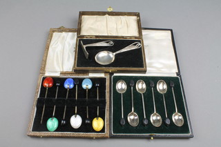 A cased set of 6 silver bean end coffee spoons, Sheffield 1925, a ditto set with guilloche enamelled backs (1f) and a cased christening set 