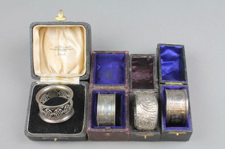A Victorian repousse silver cased napkin ring Chester 1895 and 3 others, approx 78 grams