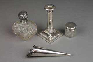 A tapered silver posy holder, Birmingham 1912, a dwarf candlestick and 2 mounted toilet jars