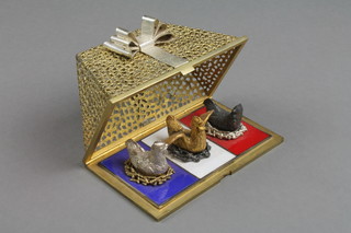 Stuart Devlin, a silver, silver gilt and enamel, Twelve Years of Christmas Surprise Box  - Three French Hens, enclosed in a pierced triangular box with ribbon festoon, London 1972, limited edition 76/100, boxed, approx. 408 grams