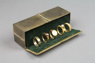 Stuart Devlin, a silver, silver gilt and gem set Twelve Years of Christmas Surprise box - Five Gold Rings, enclosed in a rectangular box with ribbon festoon, limited edition no.76/100, boxed, London 1974, approx. 274 grams