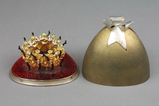 Stuart Devlin, a silver, silver gilt and enamel Twelve Years of Christmas Surprise box - Nine Ladies Dancing, enclosed in a triangular silver gilt box with ribbon crest, limited edition no. 76/100, boxed, London 1978, approx. 268 grams