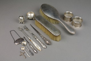 2 silver napkin rings, a silver table salt, 2 silver backed brushes and minor items