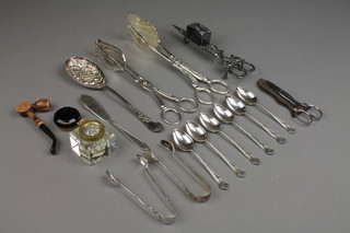 A silver plated candle snuffer, minor plated cutlery, berry spoons, etc 