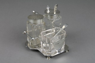 A Victorian silver condiment stand, London 1898, approx. 156 grams together with 3 matched glass condiments