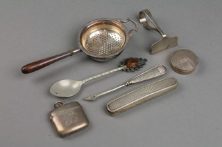 A silver vesta, an engine turned box, a silver tea strainer and minor items 