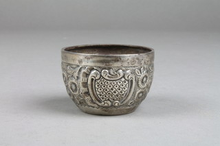 An Edwardian repousse silver table salt with scroll and floral decoration, Birmingham 1902