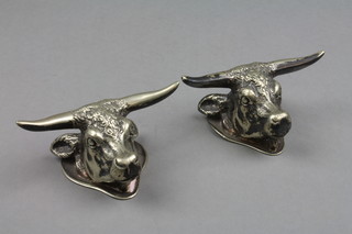 A pair of Edwardian silver plated knife rests in the form of bulls heads